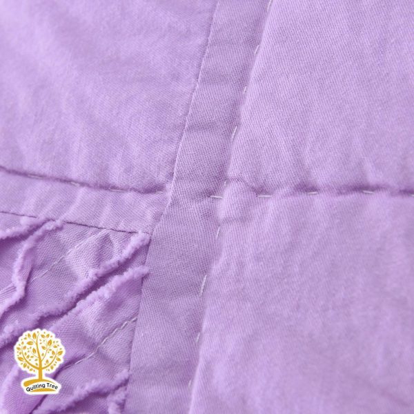 purple ruffle quilt